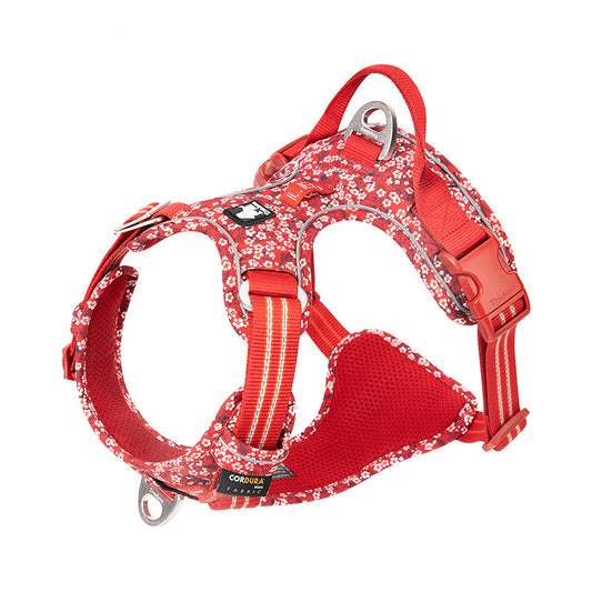 Röd blommig hundsele med reflexdetaljer och justerbara remmar för säker passform