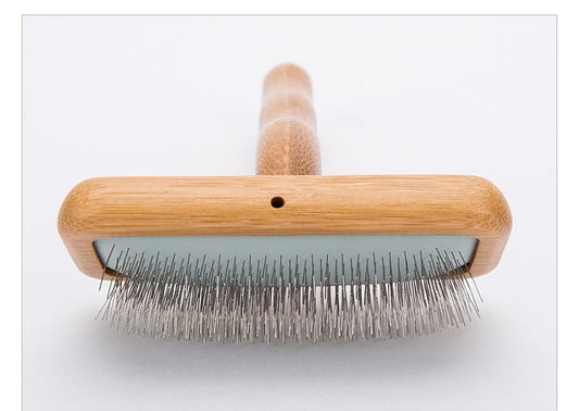 Pälsborste för hundar som motverkar tovor och trassel