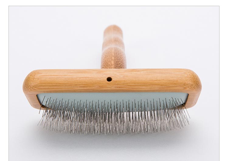 Pälsborste för hundar som motverkar tovor och trassel